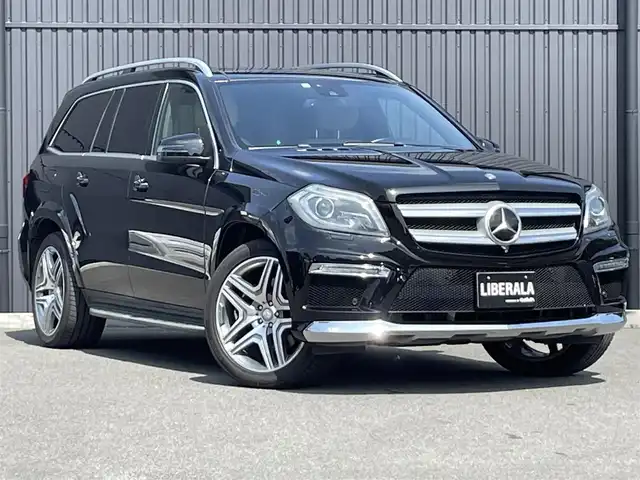 メルセデス・ベンツ ＧＬ５５０ 4MATIC AMGエクスクルーシブ 福島県 2013(平25)年 5.7万km オブシディアンブラック 左ハンドル/ＡＭＧエクスクルーシブパッケージ /・パノラミックスライディングルーフ＆３列目ガラスルーフ/・本革巻ウッドステアリング/・前席シートベンチション/・21インチ・ＡＭＧ５ツインスポークAW/・メルセデスベンツロゴ付ブレーキキャリパー/アダプティブクルーズコントロール/ブラインドスポットモニター/レーンキープアシスト/インテリジェントライト/白レザーシート/前席メモリ付パワーシート/全席シートヒーター/パワーリアゲート/純正HDDナビ(BT/USB/CD/DVD)/フルセグTV/360°カメラ/バックカメラ/ダウンヒルコントロール/サイドステップ/純正エアサスペンション/ルーフレール/ドアバイザー/積み込み冬タイヤ19AW/取扱説明書/保証書