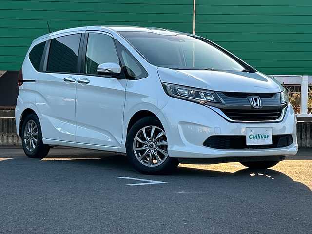 ホンダ フリード G ホンダセンシング 茨城県 2017(平29)年 9.9万km ホワイトオーキッドパール 純正ディスプレイオーディオ/Bluetooth接続/バックカメラ/ビルトインETC/アイドリングストップ/クルーズコントロール/ウォークスルー/両側パワースライドドア/横滑り防止装置/レーン逸脱警報/衝突軽減システム/オートライト/LEDヘッドライト/純正フロアマット/純正15インチアルミホイール/スマートキー/保証書/取扱説明書/記録簿/（左電動格納ミラー異音）