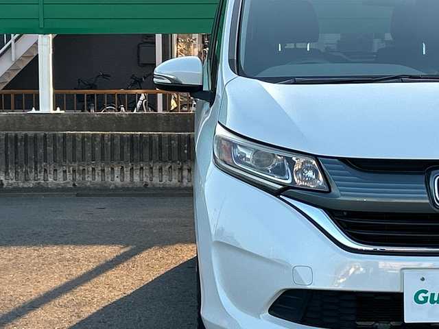 ホンダ フリード G ホンダセンシング 茨城県 2017(平29)年 9.9万km ホワイトオーキッドパール 純正ディスプレイオーディオ/Bluetooth接続/バックカメラ/ビルトインETC/アイドリングストップ/クルーズコントロール/ウォークスルー/両側パワースライドドア/横滑り防止装置/レーン逸脱警報/衝突軽減システム/オートライト/LEDヘッドライト/純正フロアマット/純正15インチアルミホイール/スマートキー/保証書/取扱説明書/記録簿/（左電動格納ミラー異音）