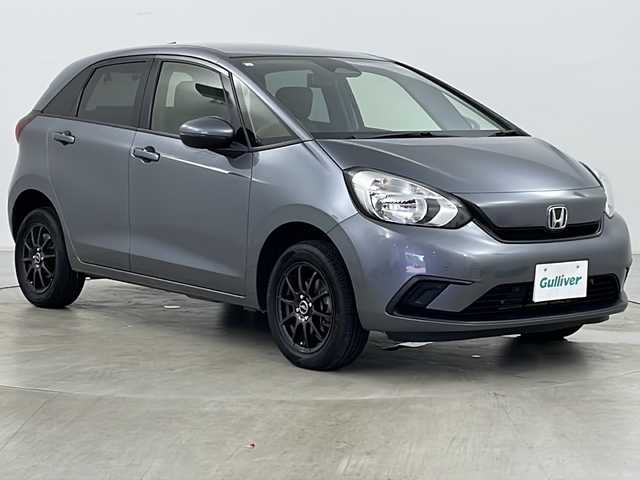 ホンダ フィット ベーシック 道央・札幌 2021(令3)年 7万km シャイニンググレーM ・4WD/・寒冷地仕様/・社外SDナビ（MDV-D308BT）/・BT&CD&DVD/・ホンダセンシング/・デジタルインナーミラー型ドラレコ前後/・クルーズコントロール/・ミラーヒーター/・ETC/・パーキングセンサー/・オートマチックハイビーム/・オートライト/・ヘッドライトレベライザー/・プッシュスタート/・スマートキー/・スペアキー1本/・積込スタッドレス/・取扱説明書