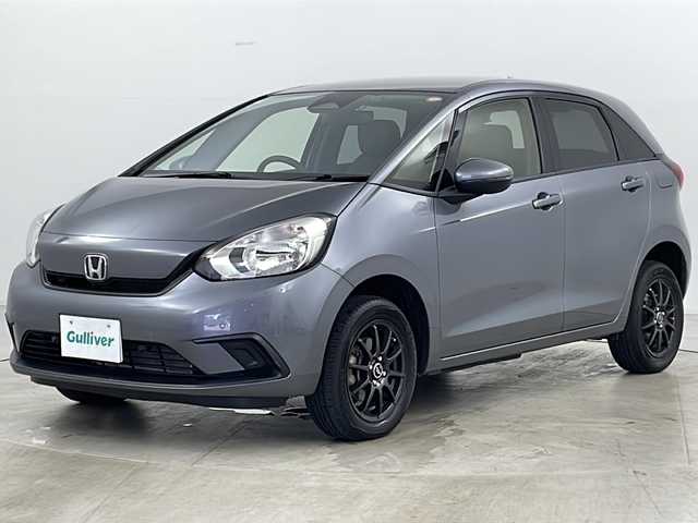 ホンダ フィット ベーシック 道央・札幌 2021(令3)年 7万km シャイニンググレーM ・4WD/・寒冷地仕様/・社外SDナビ（MDV-D308BT）/・BT&CD&DVD/・ホンダセンシング/・デジタルインナーミラー型ドラレコ前後/・クルーズコントロール/・ミラーヒーター/・ETC/・パーキングセンサー/・オートマチックハイビーム/・オートライト/・ヘッドライトレベライザー/・プッシュスタート/・スマートキー/・スペアキー1本/・積込スタッドレス/・取扱説明書