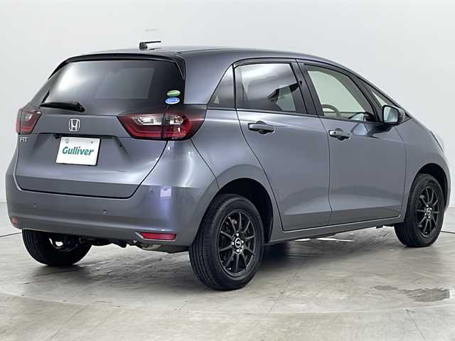 ホンダ フィット ベーシック 道央・札幌 2021(令3)年 7万km シャイニンググレーM ・4WD/・寒冷地仕様/・社外SDナビ（MDV-D308BT）/・BT&CD&DVD/・ホンダセンシング/・デジタルインナーミラー型ドラレコ前後/・クルーズコントロール/・ミラーヒーター/・ETC/・パーキングセンサー/・オートマチックハイビーム/・オートライト/・ヘッドライトレベライザー/・プッシュスタート/・スマートキー/・スペアキー1本/・積込スタッドレス/・取扱説明書