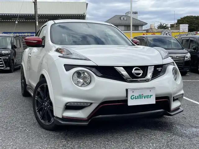 日産 ジューク ニスモ RS 千葉県 2015(平27)年 5.3万km ブリリアントホワイトパール 純正ディーラーナビ(AM/FM/BT/フルセグ/USB)/前方ドライブレコーダー/2WD⇔4WDの切り替え/セーフティーパック(盗難防止機能付き)/カロッチェリアウーハー付き/ビルトインETC/パドルシフト/横滑り防止機能/純正ニスモレカロセミバケットシート/tanabeタワーバー/オートライト/HIDヘッドライト/純正フロアマット/ウィンカーミラー/シガーソケット