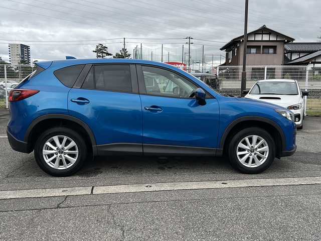マツダ ＣＸ－５ XD 富山県 2012(平24)年 14.5万km スカイブルーマイカ ワンオーナー/スマートキー×２/社外HDDナビ（CN-S310D)/DVD/BT/MSV/フルセグTV/バックカメラ/左サイドカメラ/ETC/衝突安全ブレーキ/AFS/TCS/RVM/クルーズコントロール/プッシュスタート/ステアリングスイッチ/電動格納ミラー/アイドリングストップ/ドライブレコーダー/リアスポイラー/皮巻きステアリング/純正１７インチAW/ISOFIX対応/フォグランプ/保証書・取説・ナビ取説