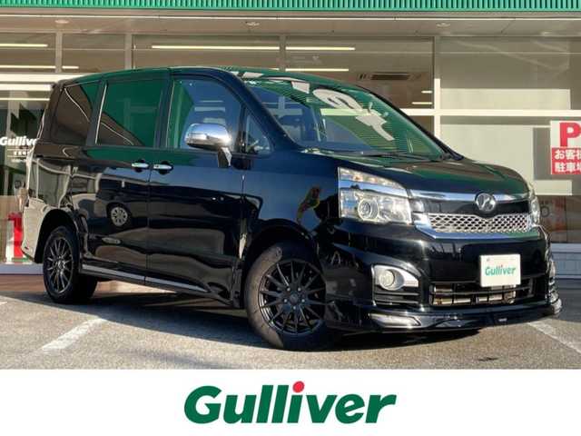 トヨタ ヴォクシー ZS 煌Z 岐阜県 2013(平25)年 7.3万km ブラック 4WD/両側パワースライドドア/モデリスタエアロ/ハーフレザーシート/純正ナビ/【Bluetooth．CD.DVD.AM/FM】/GPS(ASSURA)/ETC/ドライブレコーダー/バックカメラ/ハーフレザーシート/純正フロアマット/センターデフロック/スマートキー/保証書/取扱説明書/スペアキー