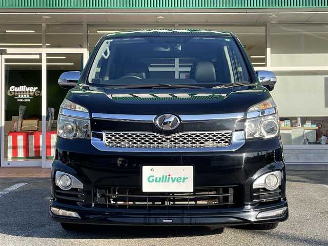 トヨタ ヴォクシー ZS 煌Z 岐阜県 2013(平25)年 7.3万km ブラック 4WD/両側パワースライドドア/モデリスタエアロ/ハーフレザーシート/純正ナビ/【Bluetooth．CD.DVD.AM/FM】/GPS(ASSURA)/ETC/ドライブレコーダー/バックカメラ/ハーフレザーシート/純正フロアマット/センターデフロック/スマートキー/保証書/取扱説明書/スペアキー