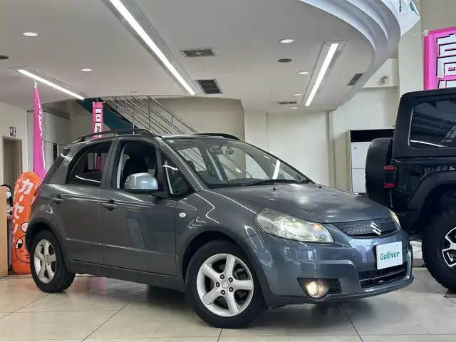 スズキ ＳＸ４ 1．5XG 東京都 2008(平20)年 5.1万km アズールグレーパールメタリック 社外オーディオ/(Kenwood U340)/(CD/AUX/USB)/純正オーディオ積み込み/前席シートヒーター/前後方ドライブレコーダー/純正フロアマット/スマートキー/ルーフレール/トノカバー/リアプライバシーガラス/ISOFIX/電動格納ミラー/HID/オートライト/フォグランプ/純正16インチアルミホイール/革巻きステアリング/W+サイドSRS&ABS/新車時保証書/取扱説明書