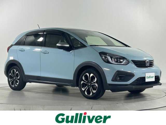 ホンダ フィット e:HEVクロスター 佐賀県 2022(令4)年 3.3万km サーフブルー 純正9インチナビ/CD/DVD/フルセグTV/BT/衝突被害軽減システム/横滑り防止装置/車線逸脱防止/クリアランスソナー/オートライト/LEDヘッドライト/前後ドライブレコーダー/ETC/追従付きクルーズコントロール/オートブレーキホールド/電動格納ミラー/ECOスイッチ/ISOFIX/フロアマット/純正16インチアルミホイール/ドアバイザー
