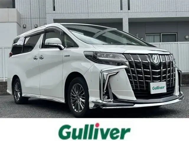 トヨタ アルファードハイブリット エグゼクティブ ラウンジ S 愛知県 2020(令2)年 9.9万km ホワイトパールクリスタルシャイン 純正メーカーオプション10型ナビ【Bluetooth　CD DVD SD USB】/JBLサウンドシステム/シーケンシャルウィンカー/全方位カメラ/ビルトインETC2.0/後席フリップダウンモニター/デジタルインナーミラー/ドライブレコーダー/両側パワースライドドア/トヨタセーフティセンス/・衝突軽減ブレーキ/・レーンキープアシスト/・オートマチックハイビーム/オートライト/LEDヘッドライト/フォグランプ/アダプティブクルーズコントロール/ブレーキホールド/ブラインドスポットモニター/リアクロストラフィックアラート/ロードサインアシスト/パーキングサポートブレーキ/ステアリングリモコン/ステアリングヒーター/全席シートヒーター/全席エアシート/全席パワーシート/AC100V/電動リアゲート/オート電動格納ドアミラー/ドアバイザー/純正フロアマット/純正アルミホイール/禁煙車