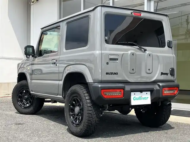 スズキ ジムニー XC 山口県 2022(令4)年 1万km ミディアムグレー 1inリフトアップ(バネ)/社外ディスプレイオーディオ/　＆バックカメラ/社外16インチアルミ/デュアルセンサーブレーキサポート/純正フロアマット/純正フォグランプ/ウィンカーミラー/スマートキー/エンジンプッシュスタート/オートライト/フロントシートヒーター/ETC