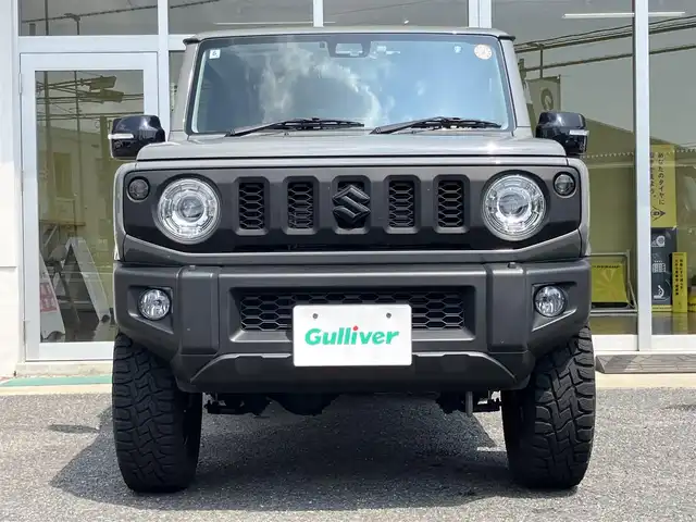 スズキ ジムニー XC 山口県 2022(令4)年 1万km ミディアムグレー 1inリフトアップ(バネ)/社外ディスプレイオーディオ/　＆バックカメラ/社外16インチアルミ/デュアルセンサーブレーキサポート/純正フロアマット/純正フォグランプ/ウィンカーミラー/スマートキー/エンジンプッシュスタート/オートライト/フロントシートヒーター/ETC