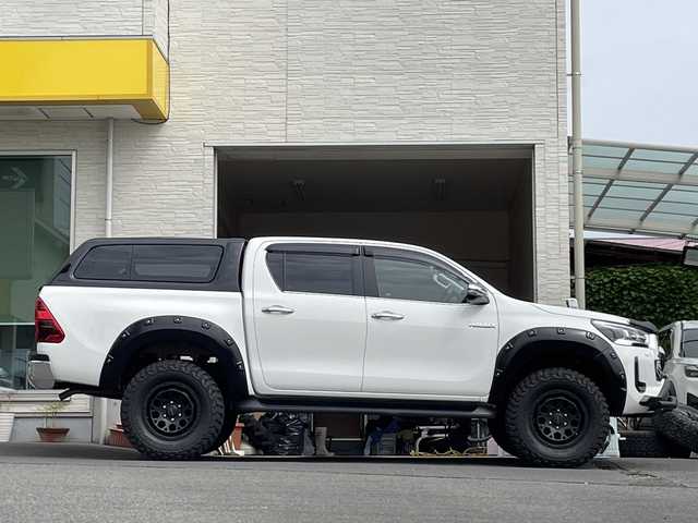 トヨタ ハイラックス Z 大分県 2021(令3)年 2.7万km スーパーホワイトⅡ ワンオーナー /レザー調シートカバー/2インチリフトアップ/ホイール2インチアップ/オプションキャノピー/オーバーフェンダー/バンパーガード/社外ナビ/フルセグTV/Bluetooth/社外ドラレコ/社外17インチアルミホイール/社外ETC/純正LEDヘッドライト/オートライト/衝突被害軽減ブレーキ/横滑り防止装置/レーンキープアシスト/コーナーセンサー/バックカメラ/4WD/純正ホイール有