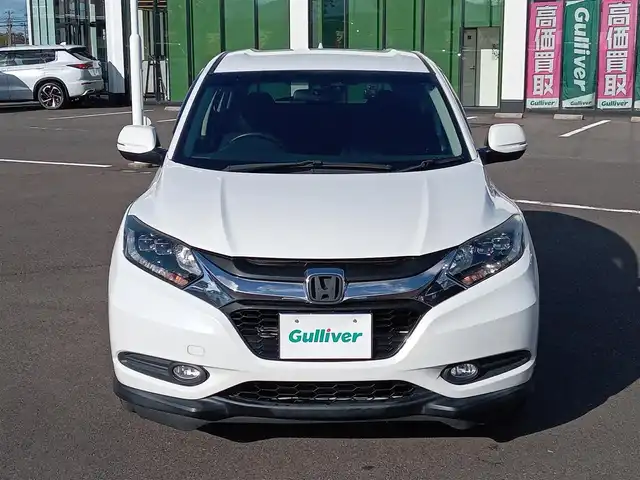 ホンダ ヴェゼル X 福井県 2015(平27)年 13.1万km ホワイトオーキッドパール 社外ナビ/フルセグテレビ/バックカメラ/クルーズコントロール/衝突被害軽減システム/アイドリングストップ/パーキングアシスト/横滑り防止装置/レーンキープアシスト/盗難防止装置/ETC/前後ドライブレコーダー/エンジンスタートボタン/LEDヘッドライト/オートライト/純正16インチAW/スマートキー
