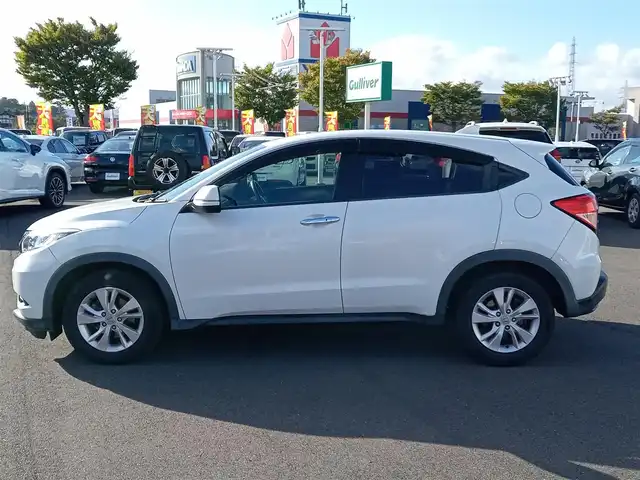 ホンダ ヴェゼル X 福井県 2015(平27)年 13.1万km ホワイトオーキッドパール 社外ナビ/フルセグテレビ/バックカメラ/クルーズコントロール/衝突被害軽減システム/アイドリングストップ/パーキングアシスト/横滑り防止装置/レーンキープアシスト/盗難防止装置/ETC/前後ドライブレコーダー/エンジンスタートボタン/LEDヘッドライト/オートライト/純正16インチAW/スマートキー