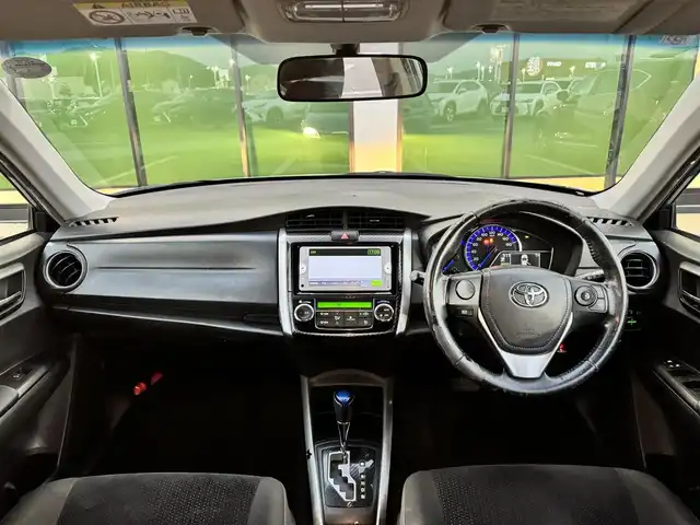 トヨタ カローラ フィールダー ハイブリッドG 香川県 2014(平26)年 16.7万km ブルーM 純正ナビ/→ワンセグ/Bluetooth/バックカメラ/社外15インチアルミ/純正フロアマット/ETC/横滑り防止装置/革巻きステアリング/ステアリングリモコン/プッシュスタート/スマートキー/パワーステアリング/パワーウィンドウ