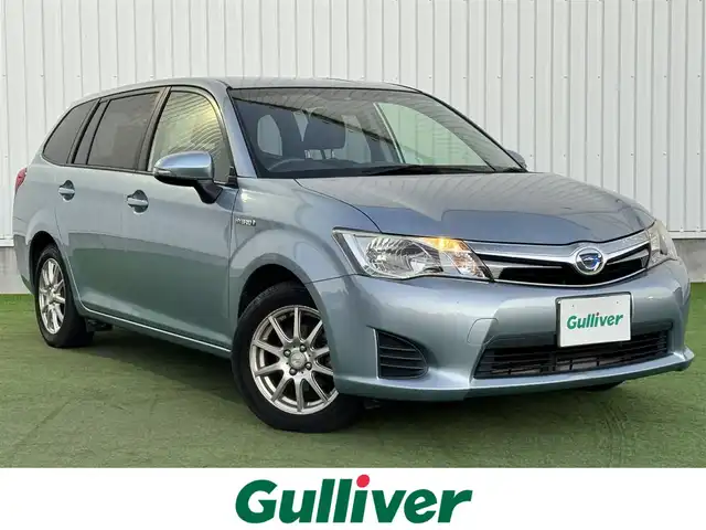 トヨタ カローラ フィールダー ハイブリッドG 香川県 2014(平26)年 16.7万km ブルーM 純正ナビ/→ワンセグ/Bluetooth/バックカメラ/社外15インチアルミ/純正フロアマット/ETC/横滑り防止装置/革巻きステアリング/ステアリングリモコン/プッシュスタート/スマートキー/パワーステアリング/パワーウィンドウ