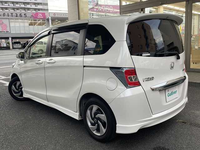 ホンダ フリード ハイブリット プレミアムエディション 大阪府 2016(平28)年 1.9万km ホワイトオーキッドパール ワンオーナー/純正メモリーナビ/フルセグTV/Bluetooth/DVD/純正フリップダウンモニター/バックカメラ/両側パワースライドドア/スマートキー/純正キセノンライト/ビルトインETC