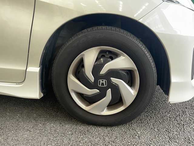 ホンダ フリード ハイブリット プレミアムエディション 大阪府 2016(平28)年 1.9万km ホワイトオーキッドパール ワンオーナー/純正メモリーナビ/フルセグTV/Bluetooth/DVD/純正フリップダウンモニター/バックカメラ/両側パワースライドドア/スマートキー/純正キセノンライト/ビルトインETC