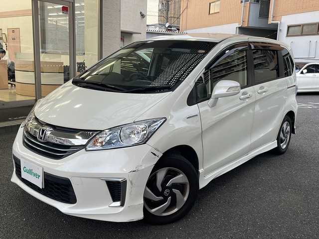 ホンダ フリード ハイブリット プレミアムエディション 大阪府 2016(平28)年 1.9万km ホワイトオーキッドパール ワンオーナー/純正メモリーナビ/フルセグTV/Bluetooth/DVD/純正フリップダウンモニター/バックカメラ/両側パワースライドドア/スマートキー/純正キセノンライト/ビルトインETC