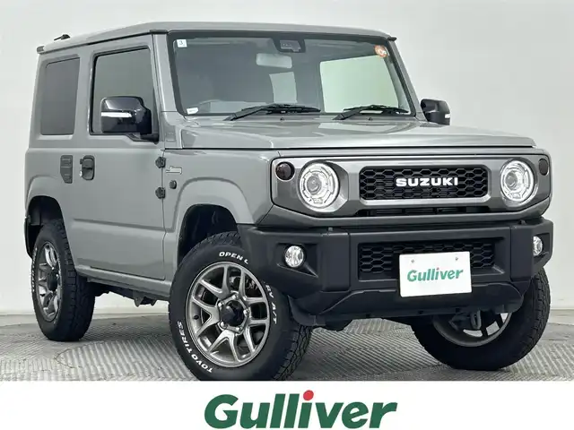 スズキ ジムニー XC 道央・札幌 2024(令6)年 1万km ミディアムグレー ・4WD/・社外メモリナビ/・フルセグ/BT/CD/DVD/・バックカメラ/・衝突被害軽減ブレーキ/・レーンキープアシスト/・クルーズコントロール/・オートハイビーム/・シートヒーター/・ミラーヒーター/・アイドリングストップ/・ダウンヒルアシスト/・ヘッドライトウォッシャー/・ステアリングスイッチ/・プッシュスタート/・スマートキー/・横滑り防止装置/・電格ミラー