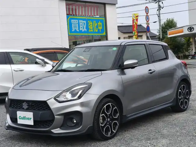 スズキ スイフト スポーツ セーフティPKG 熊本県 2019(令1)年 3.3万km プレミアムシルバーメタリック ワンオーナー/純正8インチナビ（CN-RZ843)/【フルセグTV/CD/DVD/BT】/全周囲カメラ/衝突軽減防止装置/アダプティブクルーズコントロール/レーンキープアシスト/パドルシフト/オートLEDライト/オートハイビーム/ウィンカーミラー/D席シートヒーター/純正17インチAW/プッシュスタート/スマートキー/純正フロアマット/横滑り防止装置/ABS/保証書/取扱説明書/スペアキー