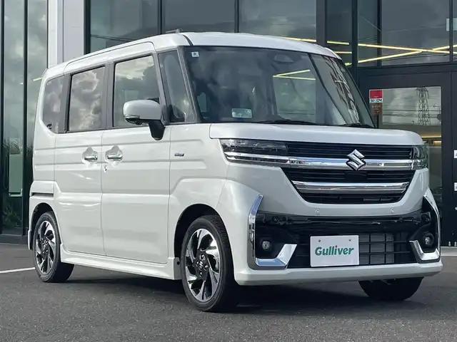 スズキ スペーシア カスタム HYBRID XS 鹿児島県 2024(令6)年 0.1千km ピュアホワイトP /オートブレーキホールド/ヘッドアップディスプレイ/純正9インチナビ/BT/フルセグ/アラウンドビューモニター/両側パワースライドドア/クルーズコントロール/LEDオートライト/オートハイビーム/ハンドルヒーター/ハーフレザーシート/シートヒーター/純正15インチアルミホイール/アイドリングストップ/スマートキー