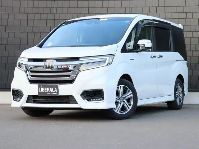 ホンダ ステップワゴン スパーダ ハイブリッド G EX ホンダセンシング 宮城県 2018(平30)年 6.4万km プラチナホワイトパール 純正インターナビ【ＢＴ／ＣＤ／ＤＶＤ／フルセグＴＶ／ＳＤ】/ワンオーナー　/ホンダセンシング　/衝突軽減ブレーキシステム/レーンキープアシスト/両側パワースライドドア　/アダプティブクルーズコントロール　/シートヒーター(DN席)/バックカメラ　/ハーフレザーシート　/ドライブレコーダー/純正フロアマット/ドアバイザー/電動格納ミラー/プッシュスタート/エンジンスターター/スマートキー/LEDヘッドライト/純正16インチAW/禁煙車