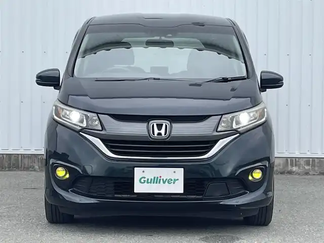 ホンダ フリード＋ G ホンダセンシング 福岡県 2019(平31)年 7.7万km フォレストグリーンパール 純正ナビ　【VXM-184VFi】/　(フルセグTV　Bluetooth  CD　DVD)　/バックカメラ/ETC　/ドライブレコーダー　/ホンダセンシング　/●衝突軽減ブレーキ〈CMBS〉/●誤発進抑制機能/●ACC〈アダプティブ・クルーズ・コントロール〉/●LKAS〈車線維持支援システム〉/●歩行者事故低減ステアリング/●路外逸脱抑制機能/●先行車発進お知らせ機能/●標識認識機能/ステアリングスイッチ/両側パワースライドドア　/ＬＥＤヘッドライト　/レーンキープアシスト/純正フロアマット/スマートキー/スペアキー/プッシュスタート