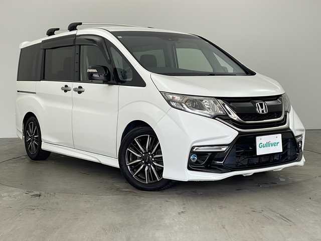ホンダ ステップワゴン モデューロX 兵庫県 2017(平29)年 10.5万km ホワイトオーキッドパール ・純正9インチナビ（フルセグ・BT・SD・DVD）/・バックカメラ/・両側パワースライドドア/・ETC/・純正ドライブレコーダー/・パドルシフト/・ステアリングリモコン/・LEDオートライト/・フォグランプ/・レーンキープアシスト/・レーダークルーズコントロール/・衝突軽減ブレーキ/・車線逸脱警報/・純正フリップダウンモニター/・横滑り防止装置/・ロールサンシェード/・純正17インチアルミホイール（モデューロ）/・モデューロ専用ブラックコンビシート/・純正フロアマット/・ドアバイザー/・アイドリングストップ/・W＋サイドエアバック/・カーテンエアバック/・スマートキー/・スペアキー/・プッシュスタート/・ECON/・電動格納ミラー