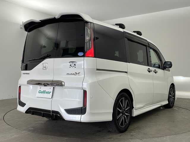 ホンダ ステップワゴン モデューロX 兵庫県 2017(平29)年 10.5万km ホワイトオーキッドパール ・純正9インチナビ（フルセグ・BT・SD・DVD）/・バックカメラ/・両側パワースライドドア/・ETC/・純正ドライブレコーダー/・パドルシフト/・ステアリングリモコン/・LEDオートライト/・フォグランプ/・レーンキープアシスト/・レーダークルーズコントロール/・衝突軽減ブレーキ/・車線逸脱警報/・純正フリップダウンモニター/・横滑り防止装置/・ロールサンシェード/・純正17インチアルミホイール（モデューロ）/・モデューロ専用ブラックコンビシート/・純正フロアマット/・ドアバイザー/・アイドリングストップ/・W＋サイドエアバック/・カーテンエアバック/・スマートキー/・スペアキー/・プッシュスタート/・ECON/・電動格納ミラー