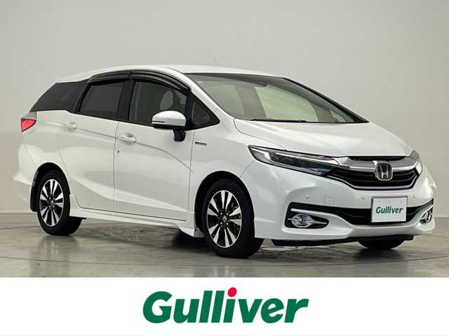 ホンダ シャトル ハイブリッド X ホンダセンシング 滋賀県 2018(平30)年 7.5万km ホワイトオーキッドパール 禁煙車/社外ナビ/CD.DVD.Bluetooth.フルセグ/バックカメラ/ホンダセンシング/●衝突軽減ブレーキ〈CMBS〉/●誤発進抑制機能/●歩行者事故低減ステアリング/●路外逸脱抑制機能/●ACC〈アダプティブ・クルーズ・コントロール〉/●LKAS〈車線維持支援システム〉/●先行車発進お知らせ機能/●標識認識機能/衝突軽減ブレーキ/レーダークルーズコントロール/レーンキープアシスト/前席シートヒーター/ビルトインETC/LEDヘッドライト/オートライト/クリアランスソナー/パドルシフト/スマートキー/スペアキー