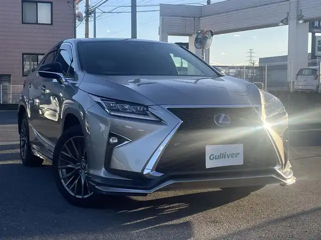 レクサス ＲＸ 450h Fスポーツ 群馬県 2016(平28)年 7万km ソニックチタニウム サンルーフ/４WD/純正SDナビ、地デジ、Bluetooth、CD、ブルーレイ/バックカメラ/プリクラッシュセーフティ/レーダークルーズコントロール/ブラインドスポットモニター/シーケンシャルウインカー/革巻きステア/パドルシフト/赤レザーシート/前席シートヒーター、エアシート、パワーシート/パワーバックドア/ウインカーミラー/クリアランスソナー（前後）/社外ドライブレコーダー（前後）/LEDヘッドライト/ビルトインETC２．０/スマートキー×１、カードキー×１/ドアバイザー/整備手帳、取説