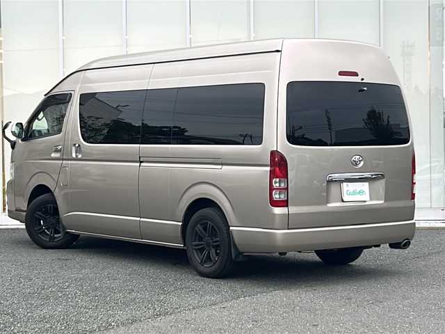 トヨタ ハイエース グランドキャビン 福岡県 2013(平25)年 9万km ゴールドM ・ワンオーナー/・3列目シート付/・Carrozzeriaナビ【AVIC-ZH99】/-BT/フルセグ/CD/DVD/SD/FM/AM/・バックカメラ/・純正フロアマット/・社外アルミ１６インチBADRUCKER】/・社外前ドラレコ[DRV-610】/・オートライト/・スペアタイヤ４本ホイール付き【195/80/15】/・片側パワースライドドア/・ドアバイザー/・電動格納ミラー/・フォグランプ/・リモコンキー