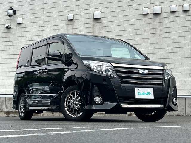 トヨタ ノア ハイブリッド Si ダブルバイビー 山形県 2016(平28)年 10.4万km ブラック 純正SDナビ/・フルセグTV/AM/FM/DVD/Bluetooth/衝突被害軽減ブレーキ/ドライブレコーダー/両側パワースライドドア/バックカメラ/レーンキープアシスト/クルーズコントロール/プリクラッシュセーフティ/オートライト/オートハイビーム/ETC/スマートキー/スペアキー/フォグランプ/冬タイヤ積載