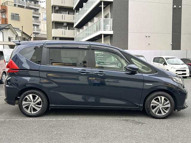 ホンダ フリード ハイブリット G ホンダセンシング 埼玉県 2020(令2)年 4.3万km ミッドナイトブルービームM 登録時４２３４５ｋｍ/ワンオーナー/純正SDナビ(フルセグ)/BT/CD/DVD/両側パワースライドドア/衝突被害軽減装置/横滑り防止装置/レーダークルーズコントロール/レーンキープアシスト/バックセンサー/ナビ連動型純正前後ドライブレコーダー/ナビ連動型ETC/バックカメラ/純正１５インチアルミホイール/ステアリングリモコン/シートヒーター（D＋N）/プラズマクラスター搭載エアコン/LEDヘッドライト/フォグランプ/ヒーテッドミラー/プッシュスタート/スマートキー/保証書/取扱説明書/ナビ取扱説明書
