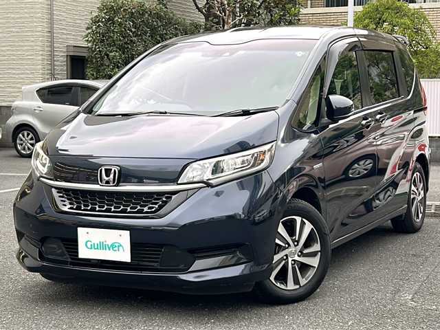 ホンダ フリード ハイブリット G ホンダセンシング 埼玉県 2020(令2)年 4.3万km ミッドナイトブルービームM 登録時４２３４５ｋｍ/ワンオーナー/純正SDナビ(フルセグ)/BT/CD/DVD/両側パワースライドドア/衝突被害軽減装置/横滑り防止装置/レーダークルーズコントロール/レーンキープアシスト/バックセンサー/ナビ連動型純正前後ドライブレコーダー/ナビ連動型ETC/バックカメラ/純正１５インチアルミホイール/ステアリングリモコン/シートヒーター（D＋N）/プラズマクラスター搭載エアコン/LEDヘッドライト/フォグランプ/ヒーテッドミラー/プッシュスタート/スマートキー/保証書/取扱説明書/ナビ取扱説明書