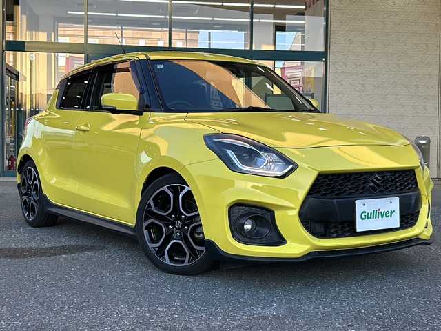 スズキ スイフト スポーツ セーフティPKG 愛知県 2019(平31)年 4.4万km チャンピオンイエロー 禁煙車/Carrozzeria社外ナビ/　AM/FM/HDMI/DISC/BT/USB/フルセグTV/HKSマフラー/純正フルエアロ/前後ドライブレコーダー/バック・全方位カメラ/レーンキープアシスト/追従機能付きクルーズコントロール/衝突被害軽減システム/横滑り防止装置/USB入力端子/ETC/オートライト/HIDヘッドライト/フォグランプ/純正フロアマット/純正17インチAW/純正ドアバイザー/W＋サイドエアバッグ/保証書/取説