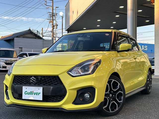 スズキ スイフト スポーツ セーフティPKG 愛知県 2019(平31)年 4.4万km チャンピオンイエロー 禁煙車/Carrozzeria社外ナビ/　AM/FM/HDMI/DISC/BT/USB/フルセグTV/HKSマフラー/純正フルエアロ/前後ドライブレコーダー/バック・全方位カメラ/レーンキープアシスト/追従機能付きクルーズコントロール/衝突被害軽減システム/横滑り防止装置/USB入力端子/ETC/オートライト/HIDヘッドライト/フォグランプ/純正フロアマット/純正17インチAW/純正ドアバイザー/W＋サイドエアバッグ/保証書/取説