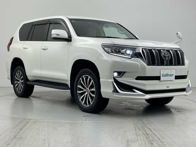 トヨタ ランドクルーザー プラド TX Lパッケージ 愛知県 2018(平30)年 3.5万km ホワイトパールクリスタルシャイン モデリスタエアロ/ベージュ本革シート/シートヒーター・エアシート/ストラーダSDナビ・フルセグTV/CD・DVD・Bluetooth/バックカメラ/純正オプション19インチAW/純正LEDヘッドライト/純正ビルトインETC/レーダークルーズコントロール/クリアランスソナー/プリクラッシュセーフティ/前席パワーシート/禁煙車
