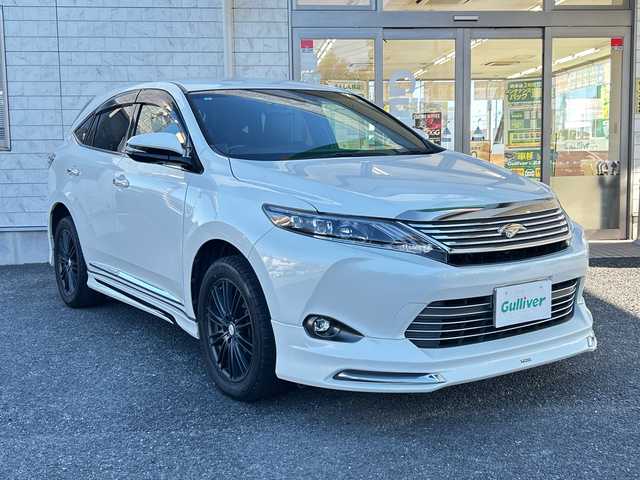 トヨタ ハリアー プレミアム 埼玉県 2017(平29)年 4.4万km ホワイトパールクリスタルシャイン 純正ナビ /(AM/FM/Bluetooth/フルセグ/DVD/CD/SD)/ETC　/バックカメラ　/ドラレコ/モデリスタエアロ　/4WD/積込純正AW19インチ(サマー)4本　/レーダー探知機　/イモビライザー　/パワーシート　/レーンキープアシスト　/電格ミラー　/アイドリング　/ISOFIX　/純正フロアマット/TRC/フォグランプ/LEDライト/プッシュスタート/パワーバックドア/オートライト/オートハイビーム/クルコン/ステアリングスイッチ/ドアバイザー/パワーステアリング/パワーウィンドウ/保証書/取扱説明書/スペアキー1本