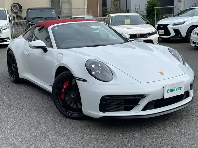 ポルシェ ポルシェ ９１１ タルガ4 GTS 神奈川県 2022(令4)年 1.3万km キャララホワイトメタリック 赤ソフトトップ/黒革シート/スポーツクロノ/スポーツエグゾースト/PASM/純正20/21インチAW/電動スポイラー/LEDヘッドライト/純正メモリーナビ/AppleCarPlay/AndroidAuto/純正USB/BT/360°カメラ/ETC2.0/ドライブレコーダー/シートヒーター/エアシート/クルーズコントロール/衝突軽減ブレーキ/BSM/コーナーセンサー/パドルシフト/アイドリングストップ/スマートキー/R5/6/7年ディーラー整備記録