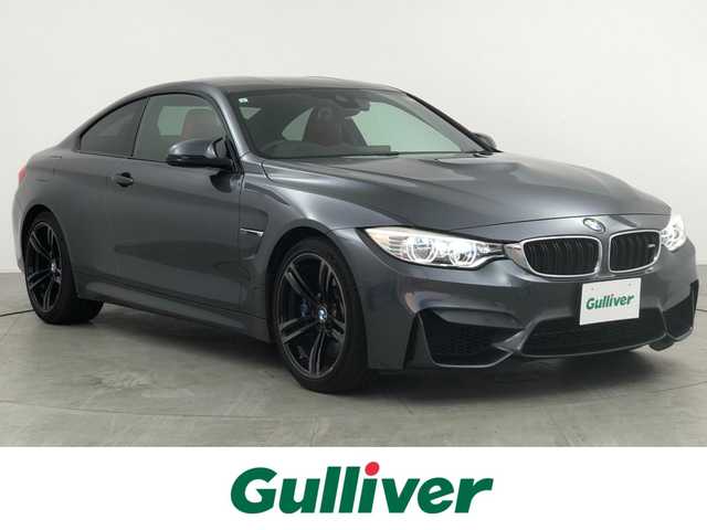 ＢＭＷ Ｍ４ クーペ 愛知県 2015(平27)年 2.6万km ミネラルグレー 純正青キャリパー/純正スリットローター/純正カーボンルーフ/パドルシフト/走行モード切替/純正ナビ/（CD/DVD/BT/ワンセグ）/バックカメラ/ETC/純正ドラレコ/前席シートヒーター/アイドリングストップ/横滑り防止/ヘッドアップディスプレイ/オートライト/フォグランプ/保証書/取扱説明書/スペアキー