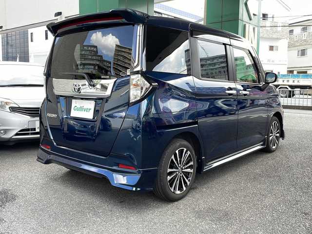 トヨタ ルーミー カスタムG－T 大阪府 2024(令6)年 0.8万km レーザーブルークリスタルシャイン ワンオーナー/純正ナビ/フルセグテレビ/AM/FM/SD/BT/USB/HDMI/CD/DVD/バックカメラ/アイドリングストップ/ウィンカーミラー/レーダークルーズコントロール/プッシュスタート/両側パワースライドドア/ビルトインETC2.0/ドライブレコーダー/シートヒーター/純正フロアマット/純正AW/コーナーセンサー/ウォークスルー/フルフラットシート/保証書/取扱説明書