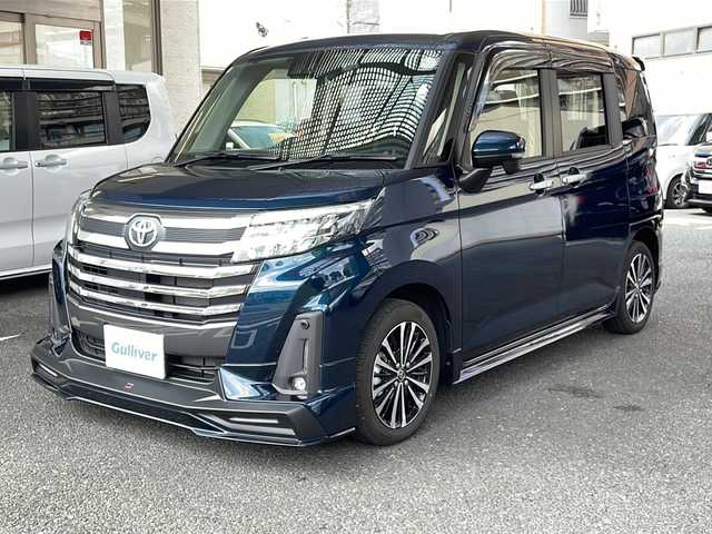 トヨタ ルーミー カスタムG－T 大阪府 2024(令6)年 0.8万km レーザーブルークリスタルシャイン ワンオーナー/純正ナビ/フルセグテレビ/AM/FM/SD/BT/USB/HDMI/CD/DVD/バックカメラ/アイドリングストップ/ウィンカーミラー/レーダークルーズコントロール/プッシュスタート/両側パワースライドドア/ビルトインETC2.0/ドライブレコーダー/シートヒーター/純正フロアマット/純正AW/コーナーセンサー/ウォークスルー/フルフラットシート/保証書/取扱説明書