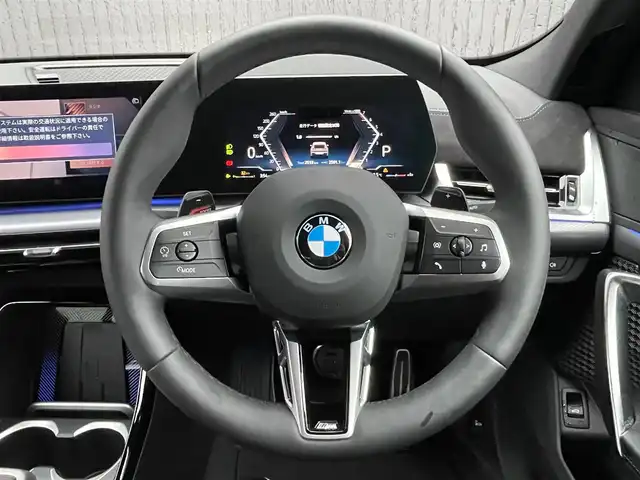 ＢＭＷ ＢＭＷ Ｘ２ xDrive 20i Mスポーツ 青森県 2025(令7)年 0.3万km グレー ４WD/カラーコードC4W　スカイクレイパーグレー/純正ナビ/（Bluetooth・USB・AppleCarPlay・AndroidAuto）/パーキングアシスト/アダプティブLEDヘッドライト/レインセンサー/ハンズオフアシスト/ステアリング・レーンコントロールアシスト/アダプティブクルーズコントロール/レーンキープアシスト/レーンチェンジアシスト/前車接近警告/後車衝突警告/インテリアカメラ/全方位カメラ/バーチャルコックピット/ヘッドアップディスプレイ/ダウンヒルアシスト/ワイヤレス充電/ハーフレザーシート/メモリー付パワーシート（D席）/前席シートヒーター/ステアリングスイッチ/パドルシフト/電動バックドア/コーナーセンサー/ウインカーミラー/エアバックW・サイド・カーテン/ABS/横滑り防止機能/盗難防止センサー/プッシュスタート/スマートキーX2/取扱説明書/保証書
