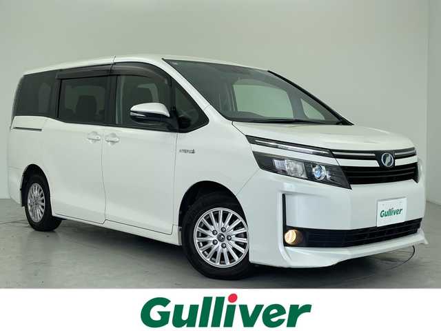 トヨタ ヴォクシー ハイブリッド V 愛知県 2014(平26)年 9.7万km ホワイトパールクリスタルシャイン 純正9型ナビ/・Bluetooth/・CD/DVD/・フルセグテレビ/純正フリップダウンモニター/衝突軽減ブレーキ/両側パワースライドドア/前後ドライブレコーダー/シートヒーター/LEDヘッドライト/アクセル踏み間違い防止/ETC