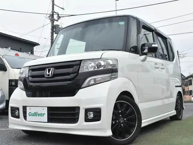 ホンダ Ｎ ＢＯＸ 2トーン カスタム G ターボLパッケージ 神奈川県 2015(平27)年 5万km プレミアムホワイトパールⅡ メモリナビAVN-Z04i/フルセグテレビ/Bluetoothオーディオ/DVD/CD/バックカメラ/両側パワースライドドア/RS-RダウンサスTi2000/4本出しマフラー/スマートキー/HIDヘッドライト/クルーズコントロール/シティブレーキシステム/アイドリングストップシステム/ETC/保証書/取扱説明書