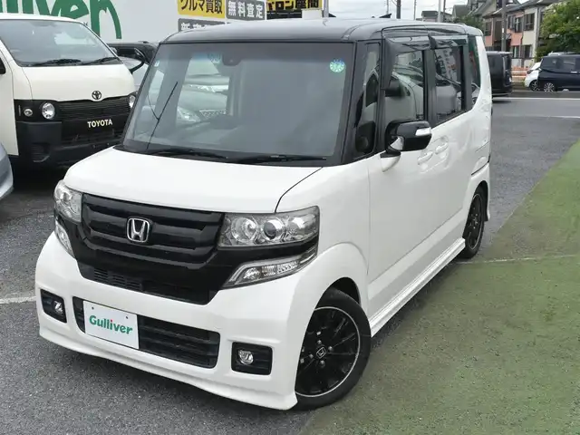 ホンダ Ｎ ＢＯＸ 2トーン カスタム G ターボLパッケージ 神奈川県 2015(平27)年 5万km プレミアムホワイトパールⅡ メモリナビAVN-Z04i/フルセグテレビ/Bluetoothオーディオ/DVD/CD/バックカメラ/両側パワースライドドア/RS-RダウンサスTi2000/4本出しマフラー/スマートキー/HIDヘッドライト/クルーズコントロール/シティブレーキシステム/アイドリングストップシステム/ETC/保証書/取扱説明書