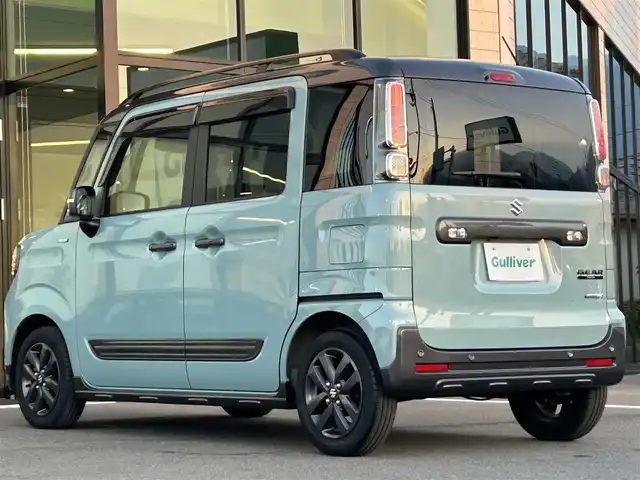 スズキ スペーシア ギア HYBRID XZターボ 愛媛県 2022(令4)年 2.5万km オフブルーメタリック/ガンメタリック2トーンルーフ ワンオーナー/純正ナビ（Bluetooth/フルセグTV）/両側パワースライドドア/ヘッドアップディスプレイ/バックカメラ/アダプティブクルーズコントロール/シートヒーター/純正フロアマット/純正14インチアルミホイール/パドルシフト/ステアリングリモコン/後席用テーブル/ルーフレール/リアセンサー/LEDヘッドライト/スマートキー