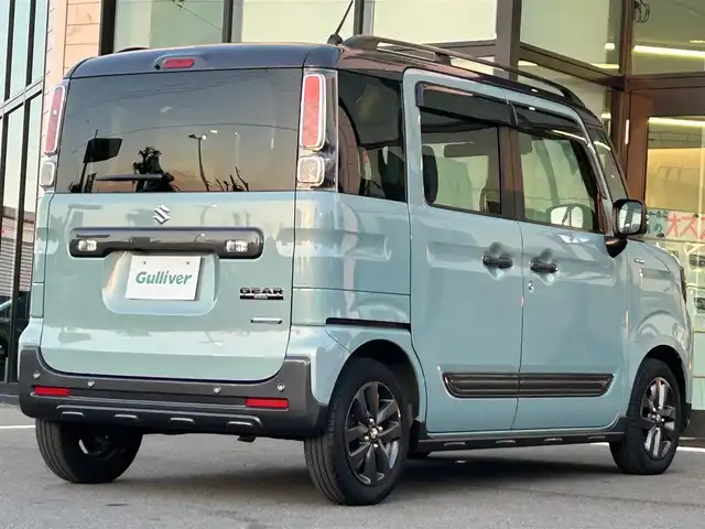 スズキ スペーシア ギア HYBRID XZターボ 愛媛県 2022(令4)年 2.5万km オフブルーメタリック/ガンメタリック2トーンルーフ ワンオーナー/純正ナビ（Bluetooth/フルセグTV）/両側パワースライドドア/ヘッドアップディスプレイ/バックカメラ/アダプティブクルーズコントロール/シートヒーター/純正フロアマット/純正14インチアルミホイール/パドルシフト/ステアリングリモコン/後席用テーブル/ルーフレール/リアセンサー/LEDヘッドライト/スマートキー
